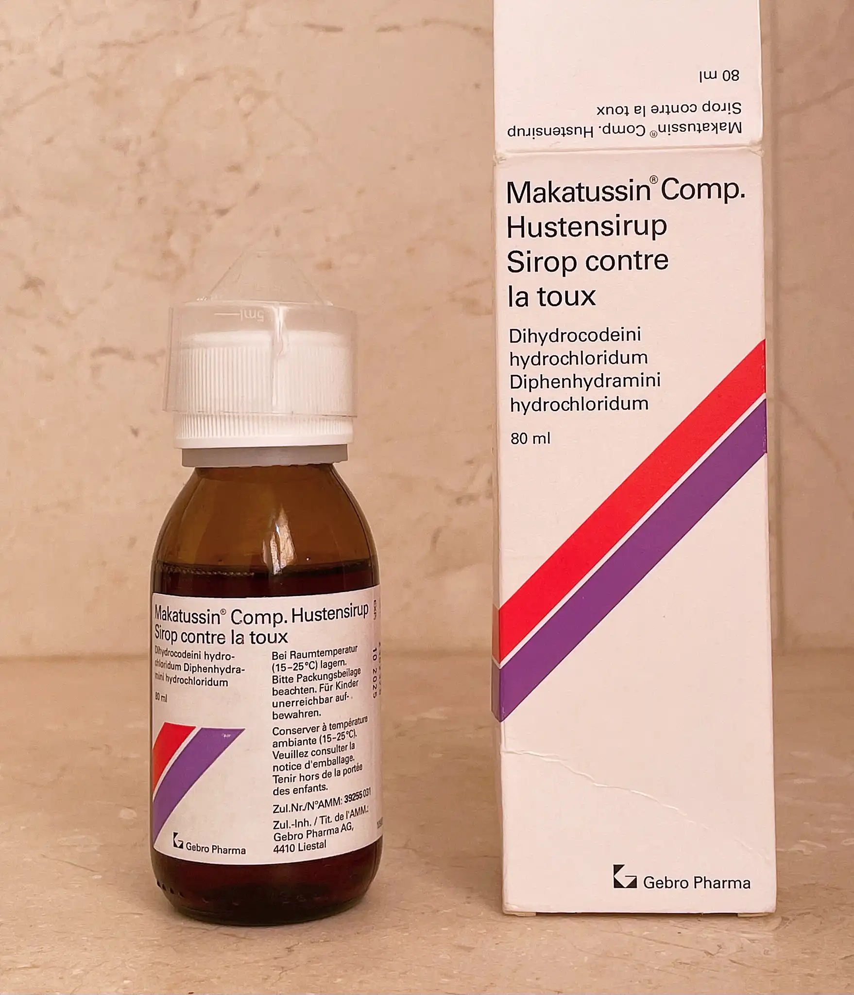 Certified Swiss pharmaceutical Makatussin Comp syrup bottles lined up for pharmacy distribution